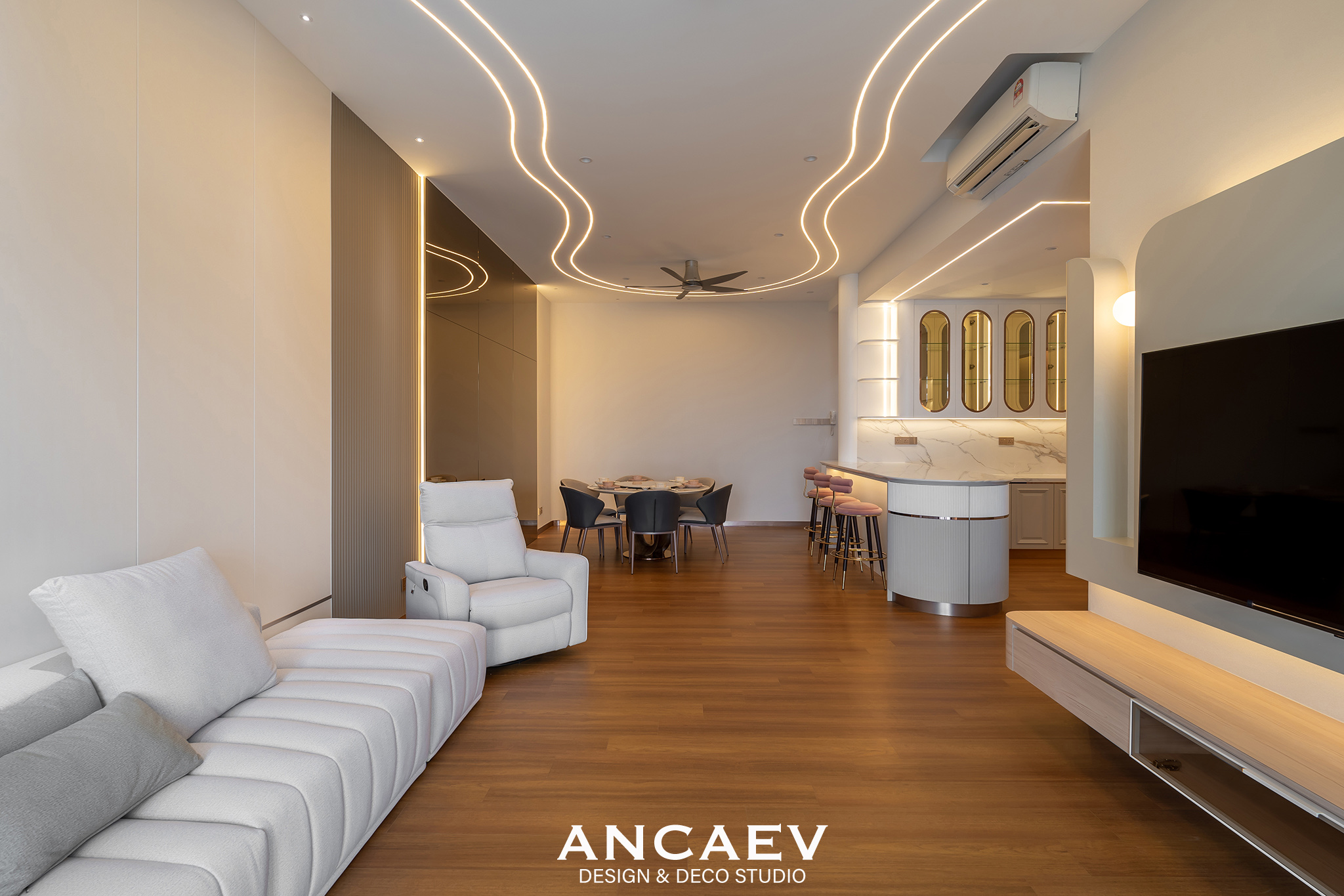 Condominium living and dining area with continuous cove lighting, built by Ancaev Design & Deco Studio